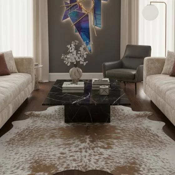 Black and white cowhide rug in a refined living room
